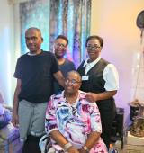 James Keys poses with his mother and sisters at his mother's home