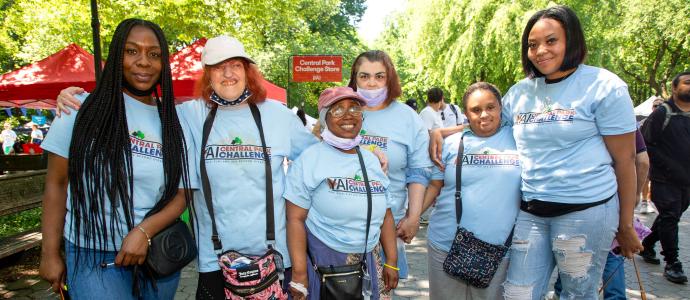 Group of women of various races and abilities stand together at the Central Park Challenge