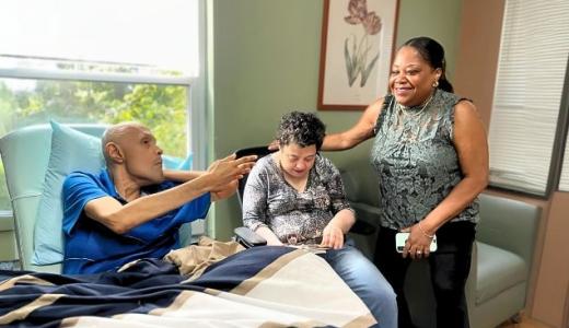 Carlos, Elaine, and Rita in a Queens residence.