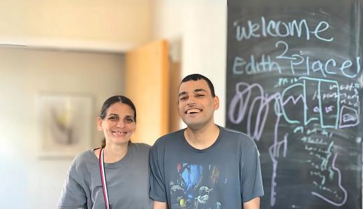 Roberto (right) stands smiling with his mother, Veronica