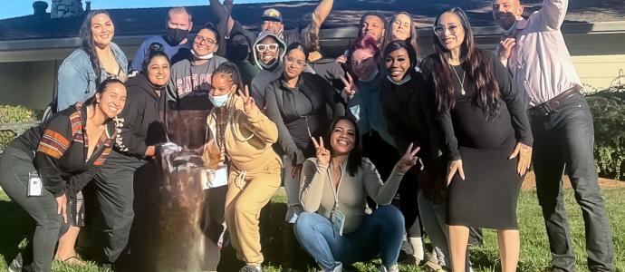 Group of people looking really happy to pose for photo