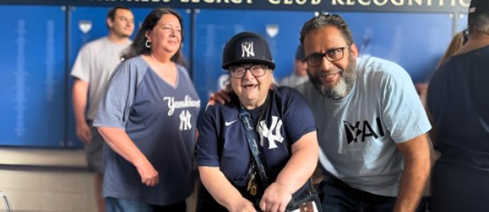 Miriam with Mohamed at Yankees game