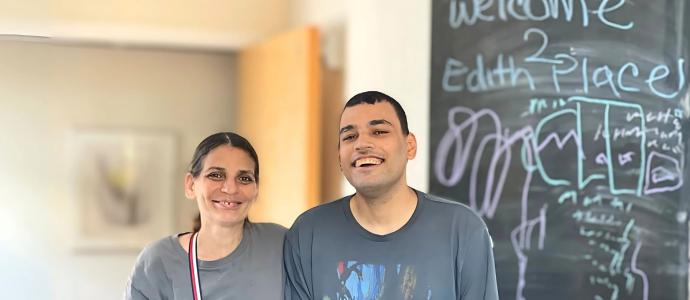 Roberto (right) stands smiling with his mother, Veronica