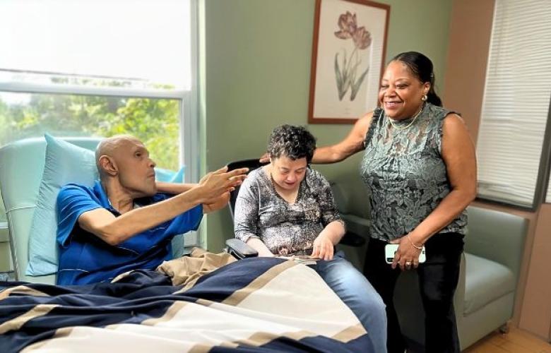 Carlos, Elaine, and Rita in a Queens residence.