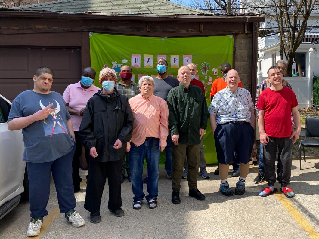 12 residents smiling for the camera