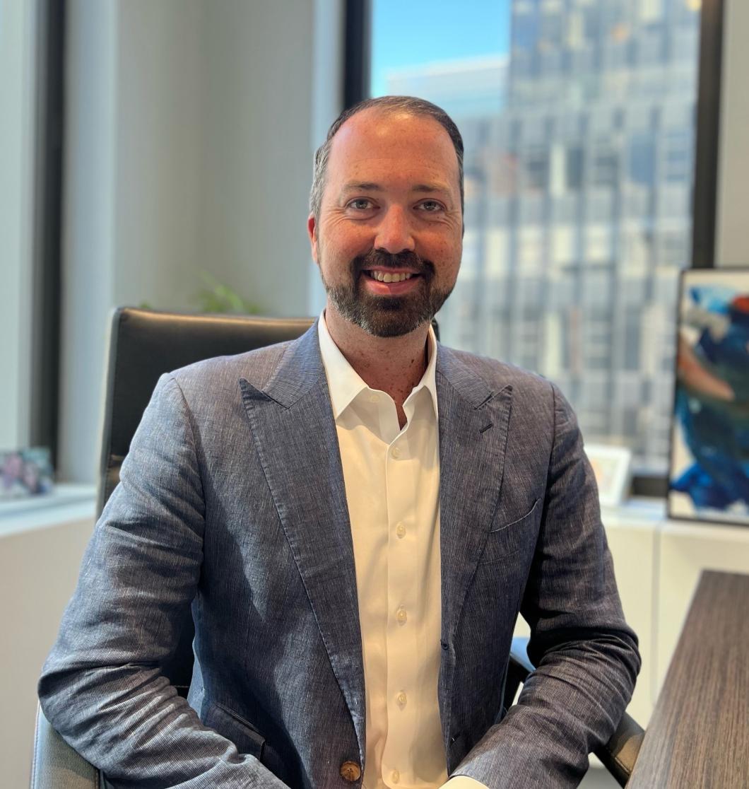 Headshot of Kevin Carey in his office