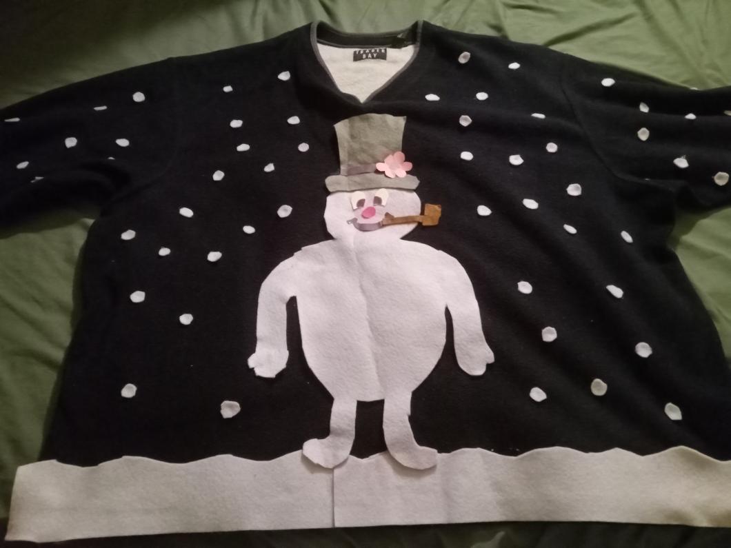 An ugly Christmas sweater created by Kenneth, it has a snowman on it