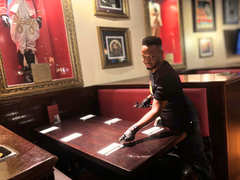 Sleiter Martinez sets a table at the Hard Rock Cafe
